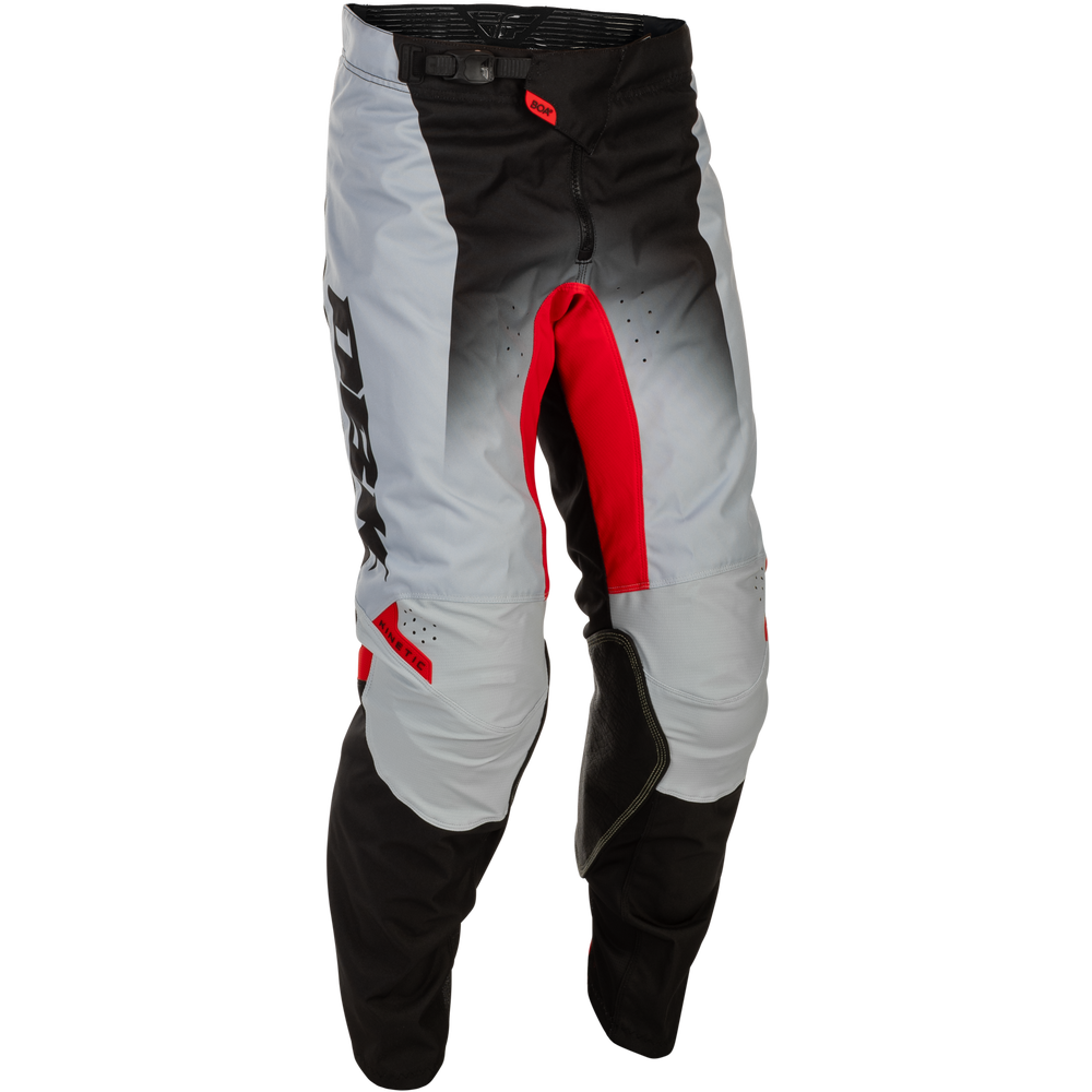 A pair of motocross pants in a gray-to-black gradient with bold red accents and black knee panels, shown against a plain white background.
