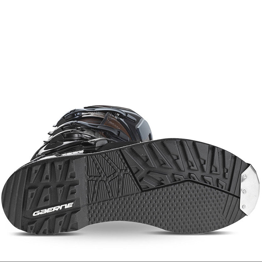 Image of the sole of a black boot on a white background