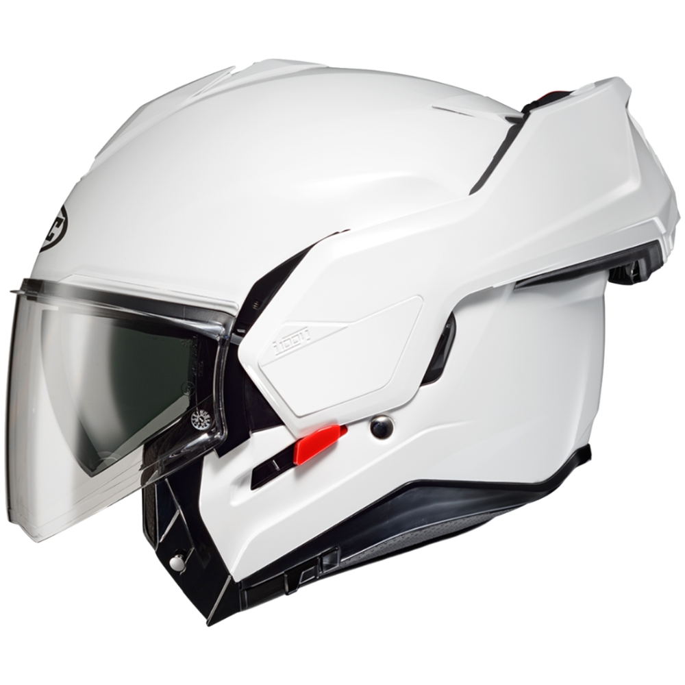 A white full-face motorcycle helmet with an integrated clear visor, black trim, and a small red switch on the side, shown against a plain white background.