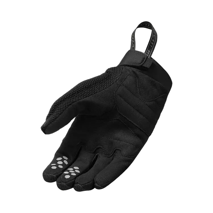 Black glove with a strap on a light gray background