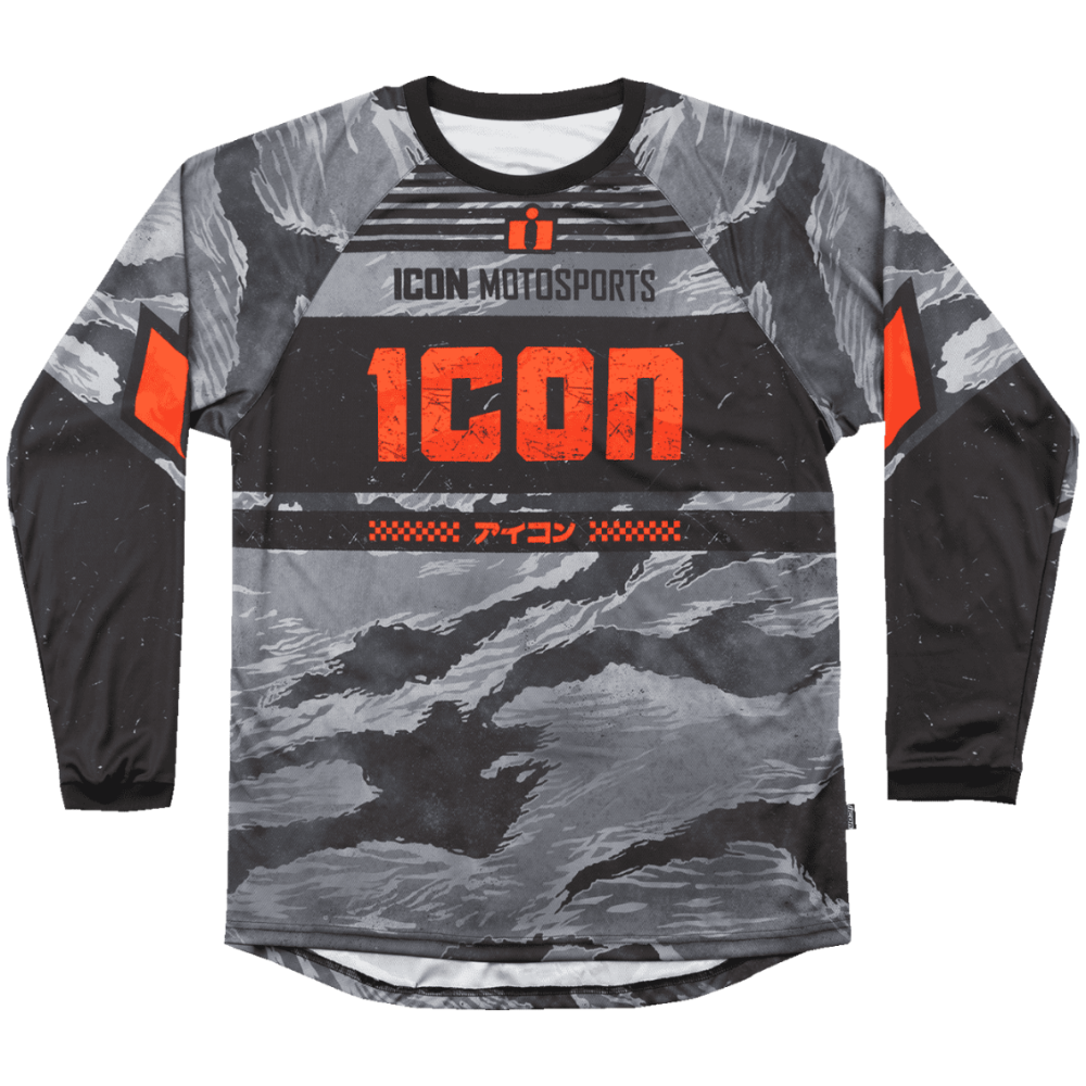 A long-sleeve motocross jersey with a gray and black camouflage pattern and bright orange accents. The chest features the text 'ICON MOTOSPORTS' and a large distressed orange 'ICON' logo, with additional Japanese text below.