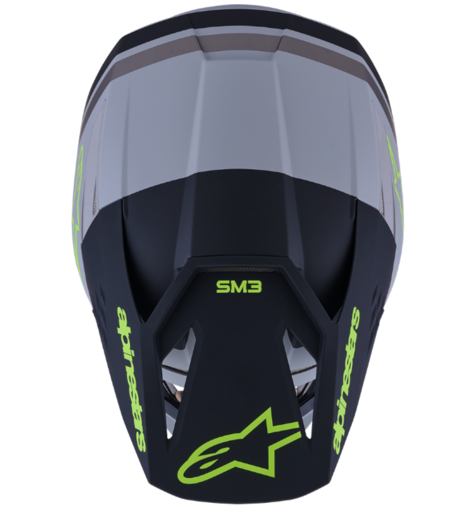 Black and gray motocross helmet with green accents and 'Alpinestars' branding on a white background.