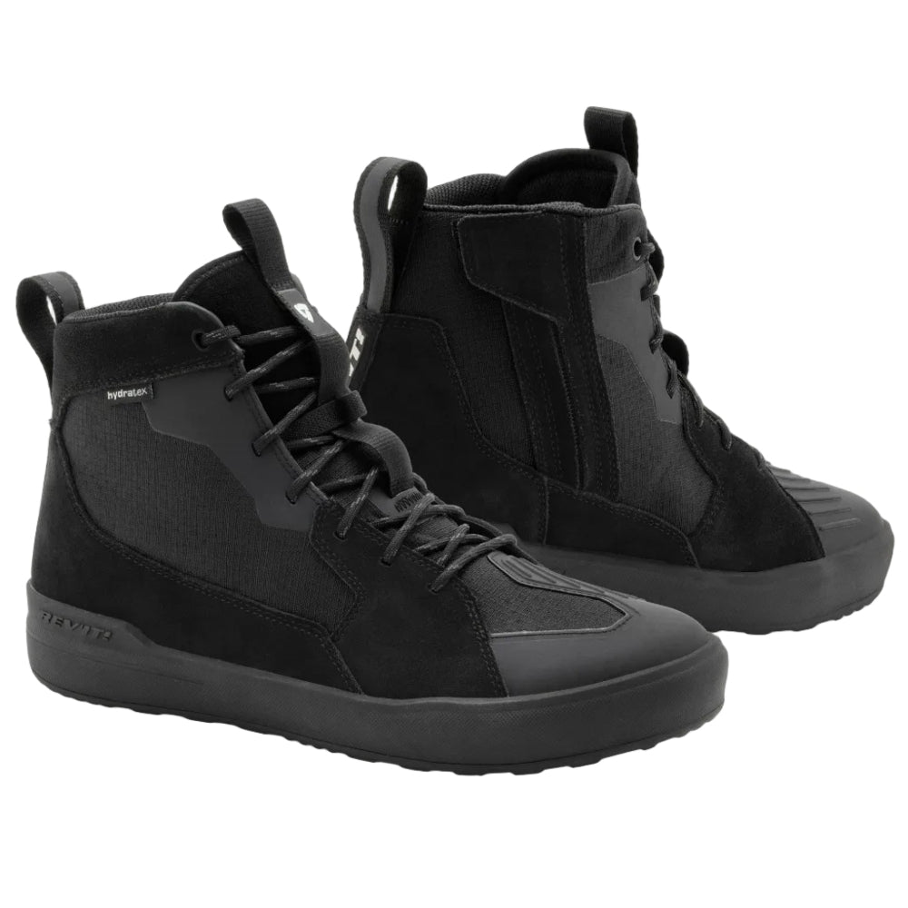 Pair of black high-top sneakers on a light gray background