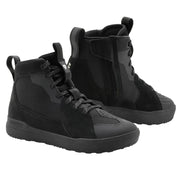 A pair of black high-top sneakers with a mix of suede, mesh, and synthetic materials, shown from a three-quarters angle on a light off-white background.