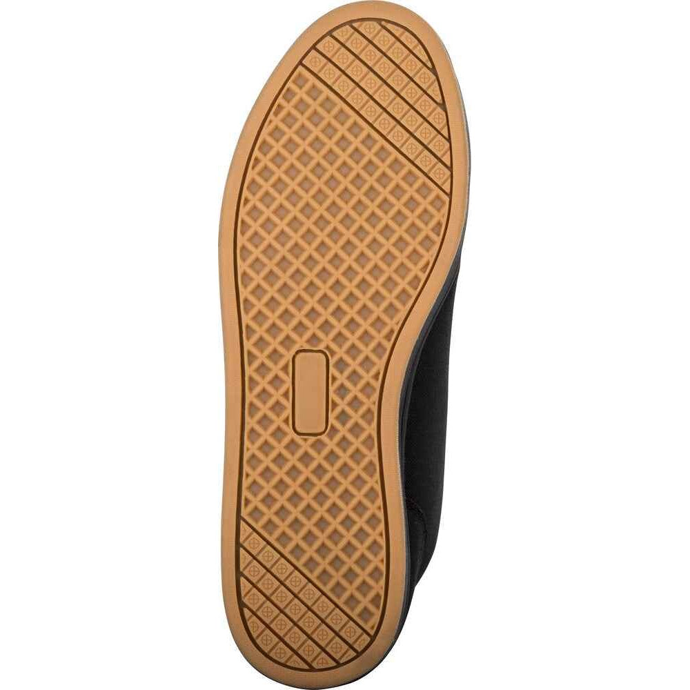 The outsole of a shoe, showing a tan rubber tread with a diamond grid pattern and a central rectangular cutout, photographed against a plain white background.