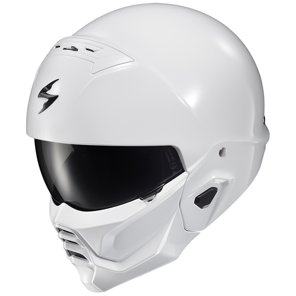 A white full-face motorcycle helmet with a dark visor, featuring a distinctive black logo on the side, shown against a plain white background.