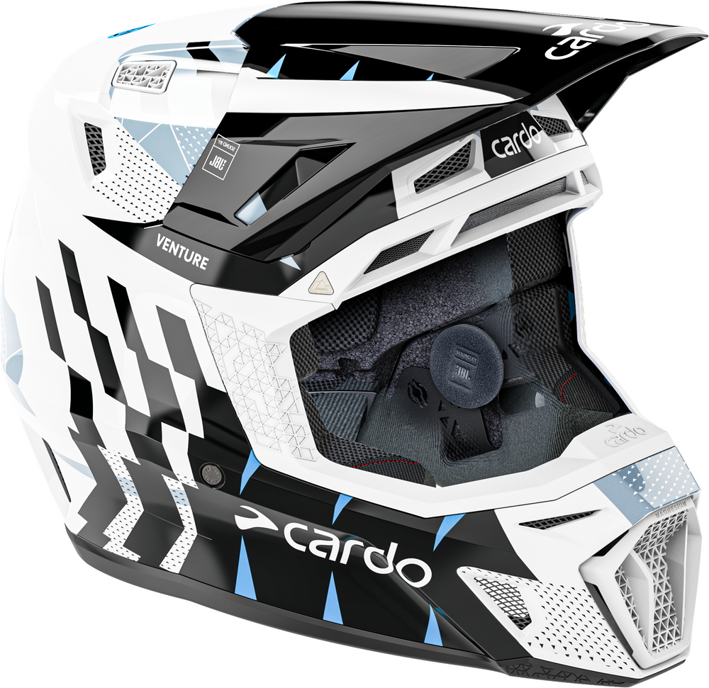 A Cardo full-face motocross helmet in white, black, and light blue, featuring a black and white checkered pattern on the side, a black visor, and a white face shield.