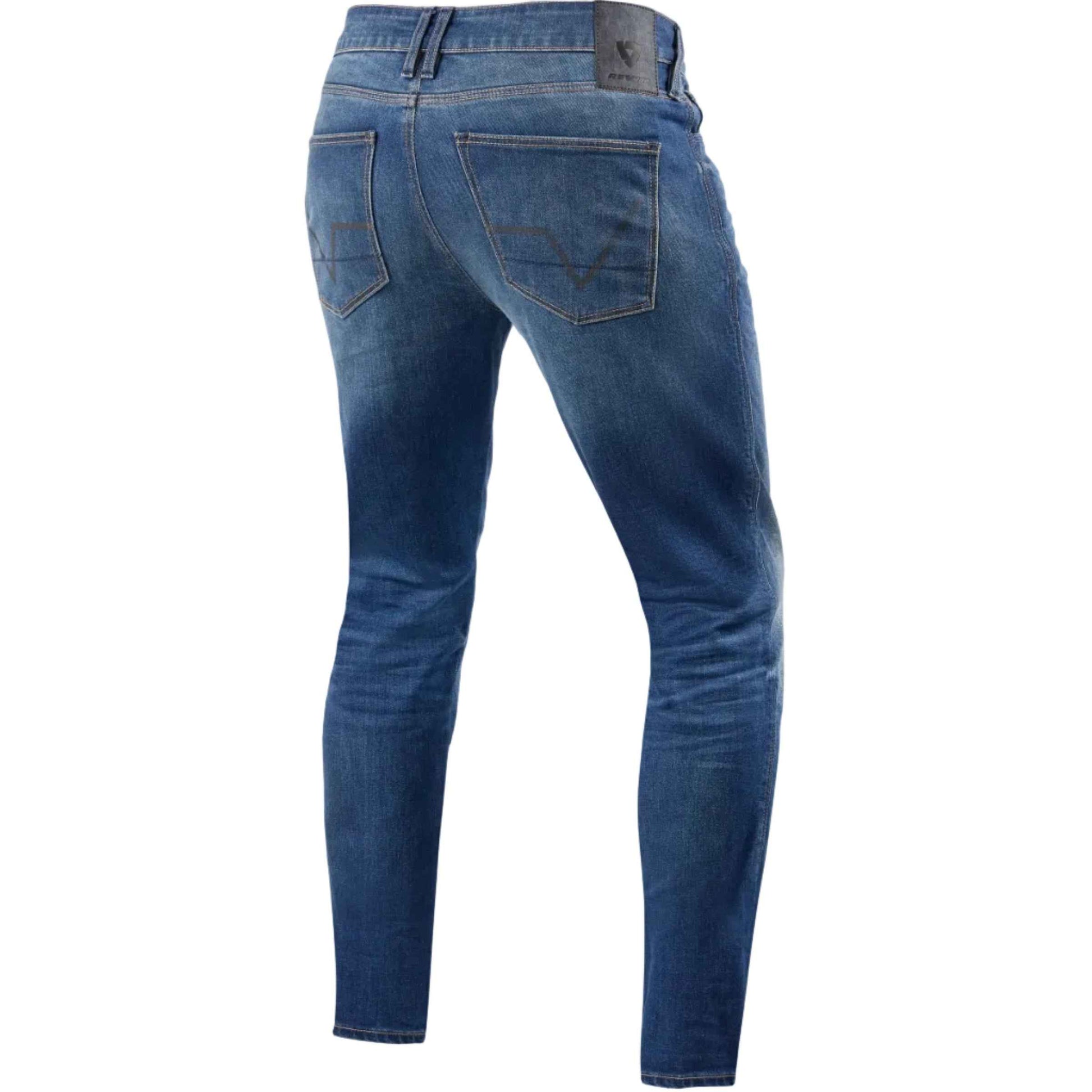 Blue slim-fit denim jeans shown from the back, featuring classic five-pocket styling and contrast stitching, displayed on a light beige background.