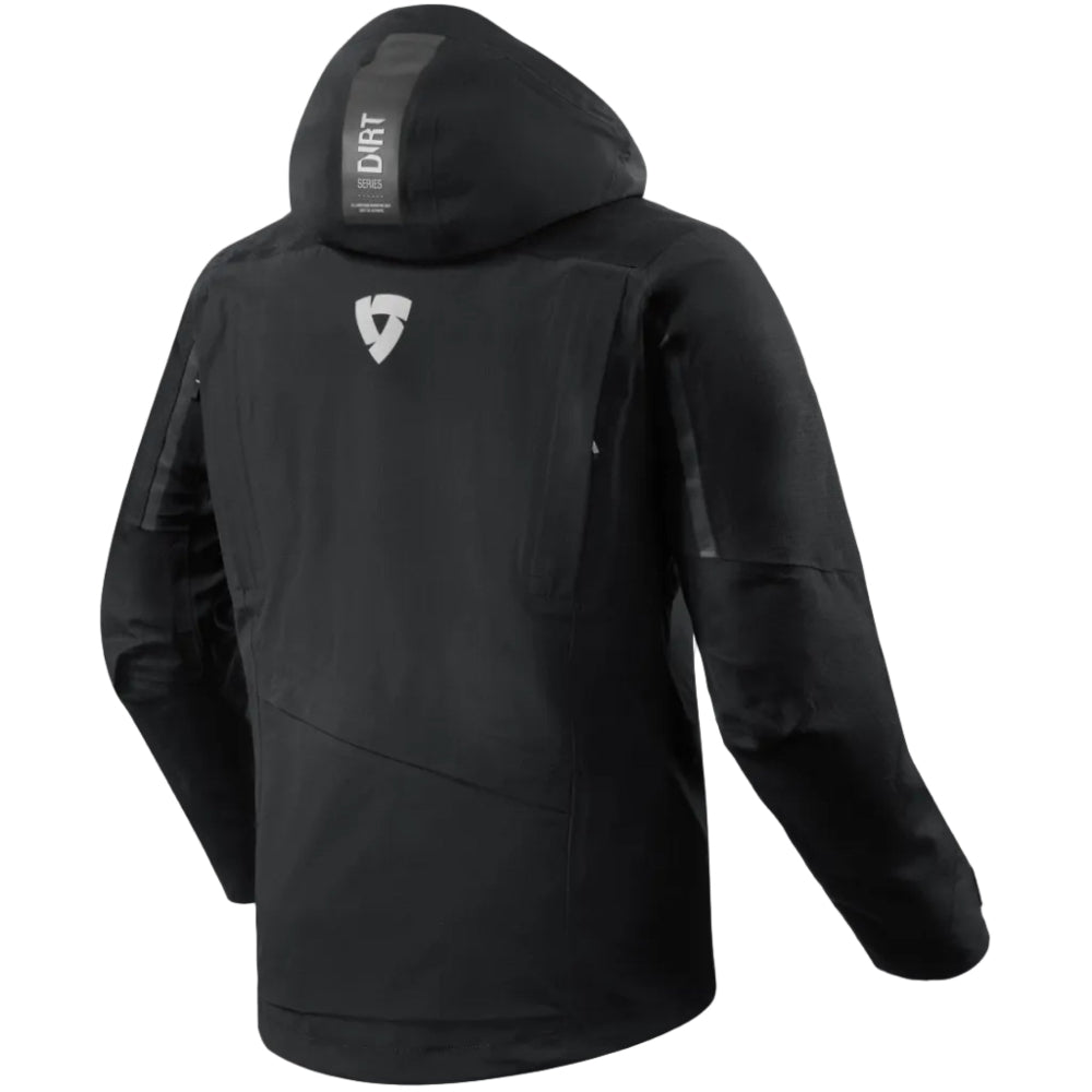 Black hooded jacket shown from the back, featuring a white shield logo on the upper back and a vertical 'DIRT' label on the inside of the hood, set against a light beige background.