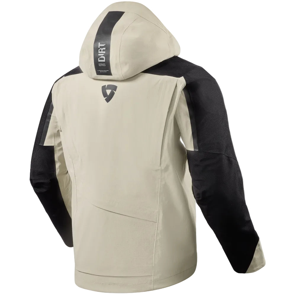 A beige and black hooded jacket shown from the back, featuring a vertical black stripe with 'DIRT' text on the hood and a small shield logo on the upper back, set against a light beige background.