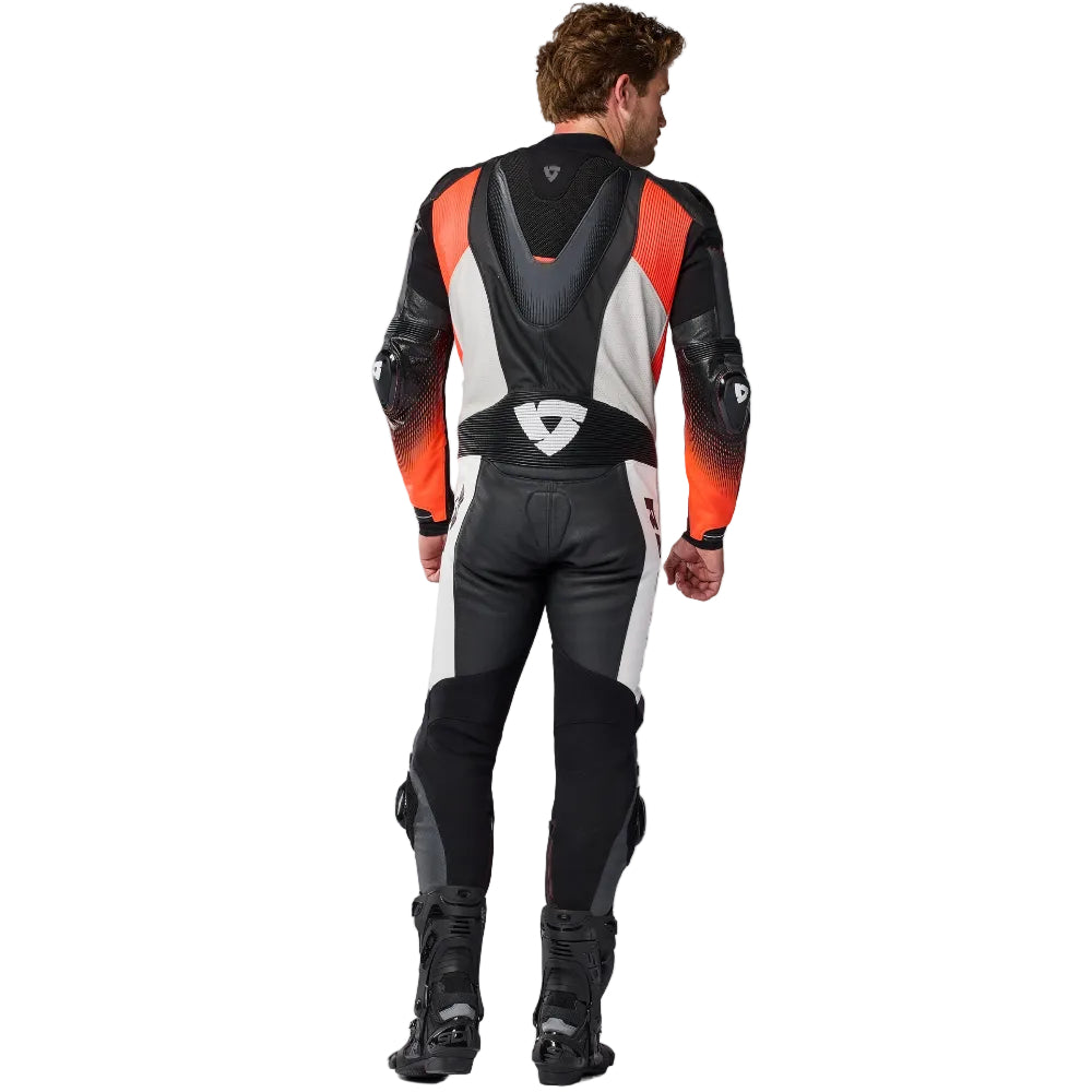 Person wearing a black, orange, and gray motorcycle suit on a white background