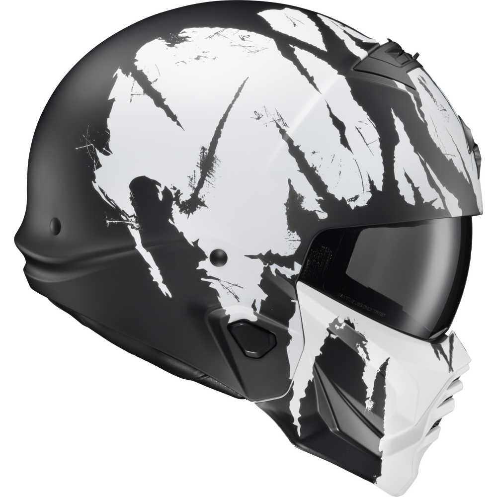 A full-face motorcycle helmet in black and white, featuring a bold white claw-mark graphic pattern across the shell and matching visor.