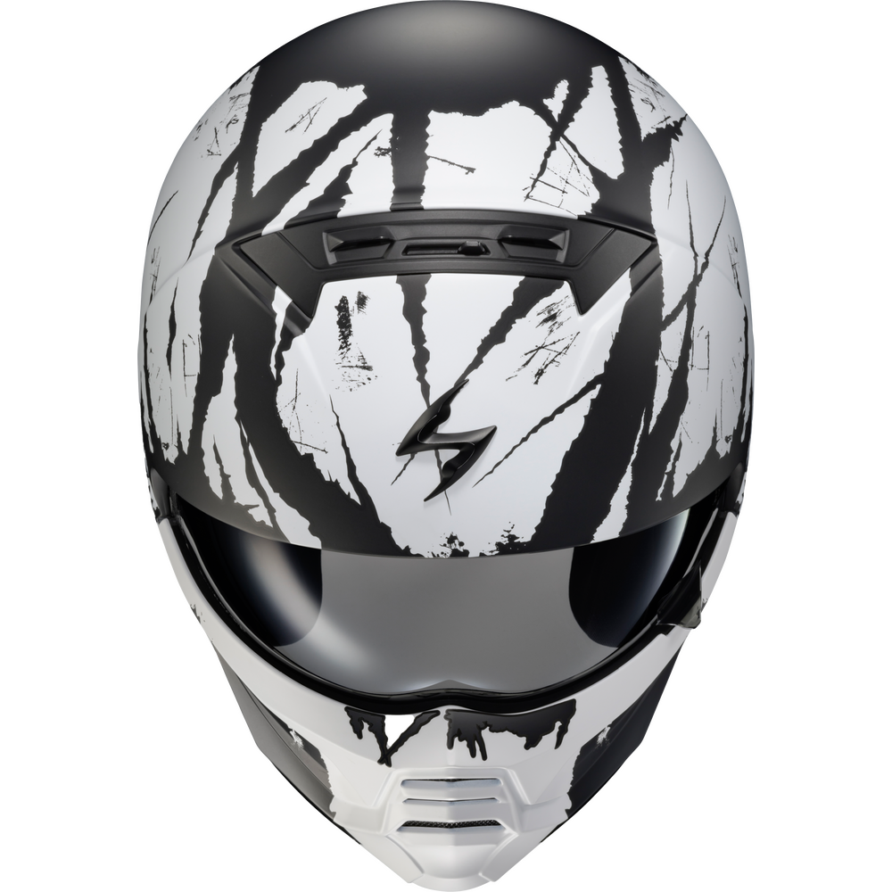 A full-face motorcycle helmet with a black and white tiger-stripe graphic pattern, a dark visor, and a black logo on the forehead, shown against a plain white background.