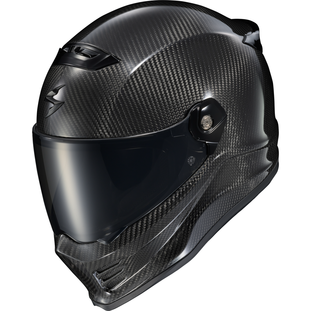 A full-face motorcycle helmet with a glossy black carbon fiber pattern and a dark visor, shown on a plain white background.