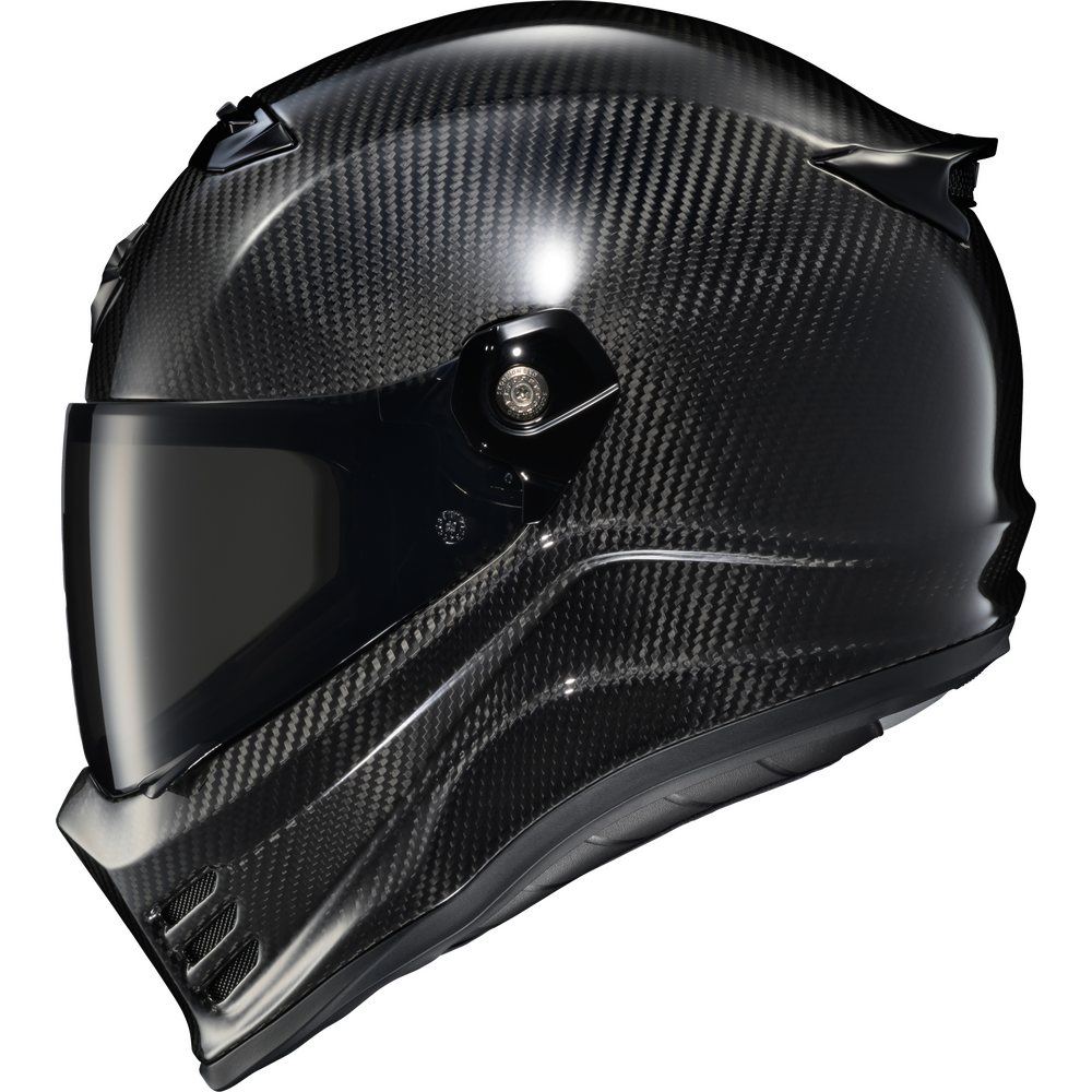 A full-face motorcycle helmet featuring a glossy black carbon fiber weave pattern, a dark visor, and a black chin bar, shown against a plain white background.