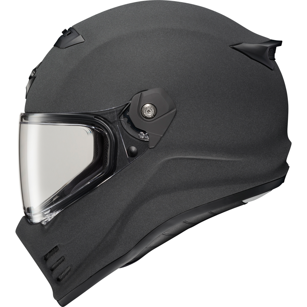 A matte black full-face motorcycle helmet with a clear visor, shown from a three-quarters side profile on a white background.