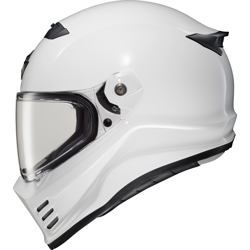A white full-face motorcycle helmet with a clear visor and black trim details, shown from a three-quarters angle on a solid white background.
