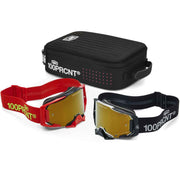 Two 100% RCNT motocross goggles with yellow mirrored lenses, one in red and one in black, displayed alongside a black zippered carrying case on a white background.