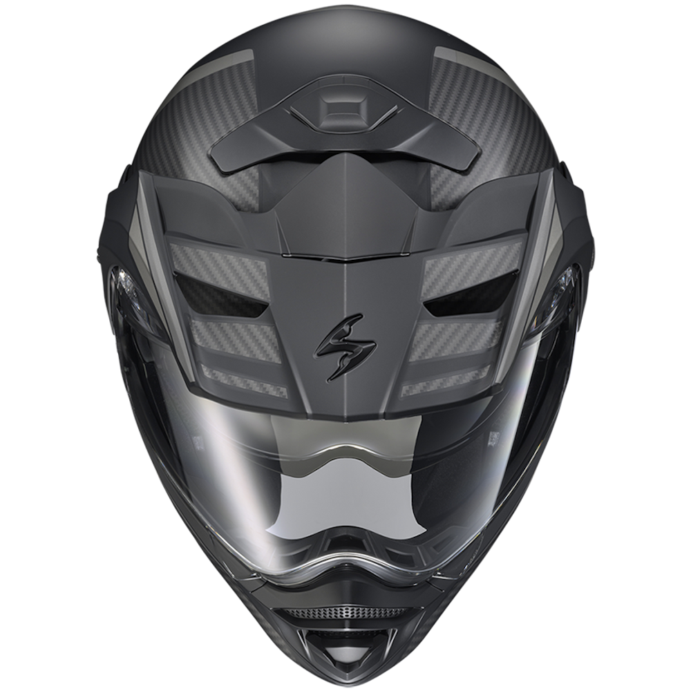 A full-face motocross helmet in matte black with a carbon fiber pattern on the shell and a clear visor, shown from a front-facing perspective on a white background.