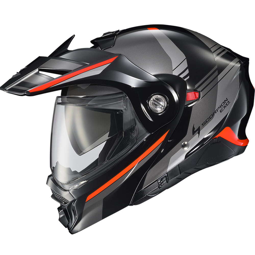 A black full-face motorcycle helmet with a clear visor, featuring orange accent stripes and a gray graphic pattern on the shell, shown against a plain white background.