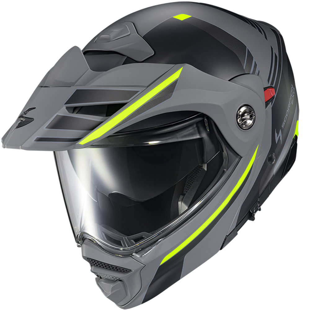 A matte dark gray full-face off-road motorcycle helmet with bright neon yellow-green accent stripes and a clear visor, shown on a plain white background.