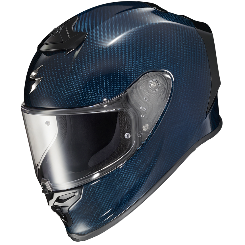 A full-face motorcycle helmet featuring a glossy dark blue carbon fiber pattern, a clear visor, and black trim details, shown against a plain white background.