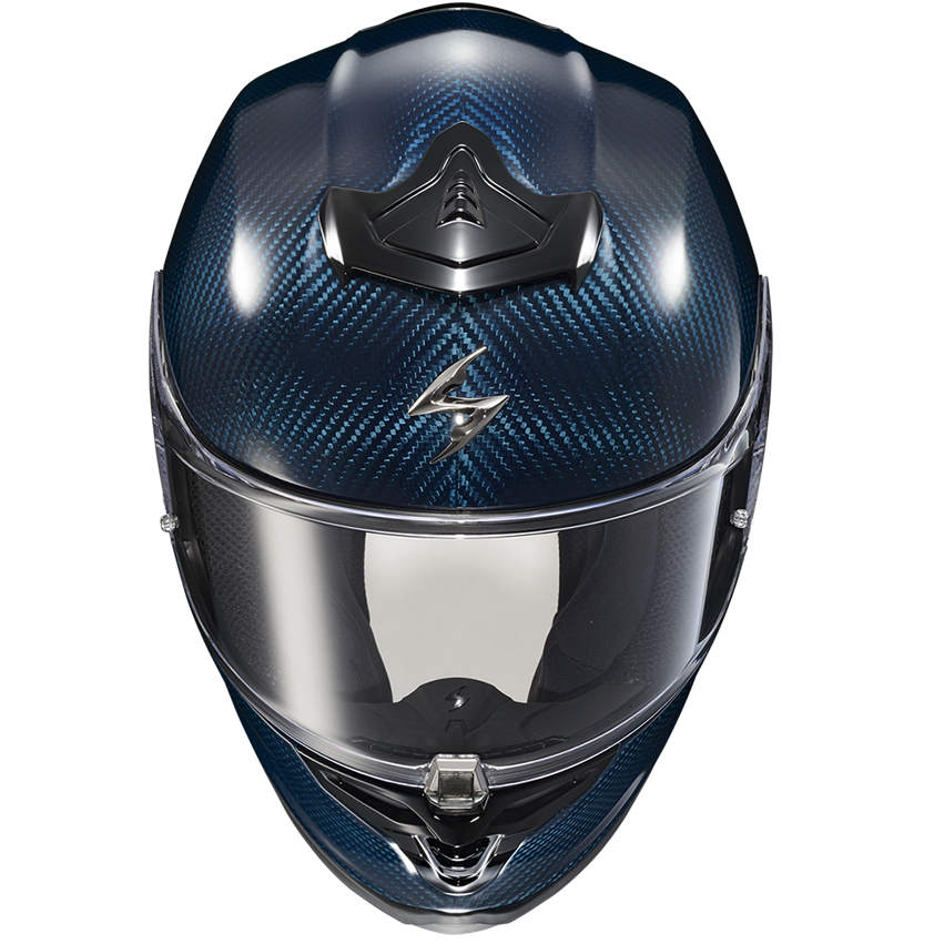 A full-face motorcycle helmet with a dark blue and black carbon fiber pattern, featuring a clear visor and a black chin guard, shown from a front-facing perspective on a white background.