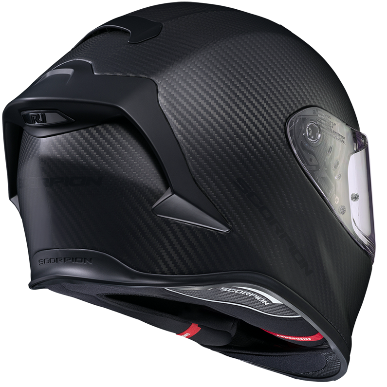 A black carbon fiber full-face motorcycle helmet with a clear visor, shown from a three-quarters rear angle on a white background.