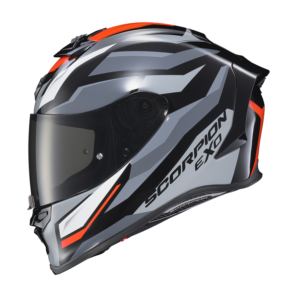 A full-face motorcycle helmet in a metallic gray, black, and white color scheme with bright orange accents and a dark visor. The brand name 'SCORPION EXO' is printed on the side.