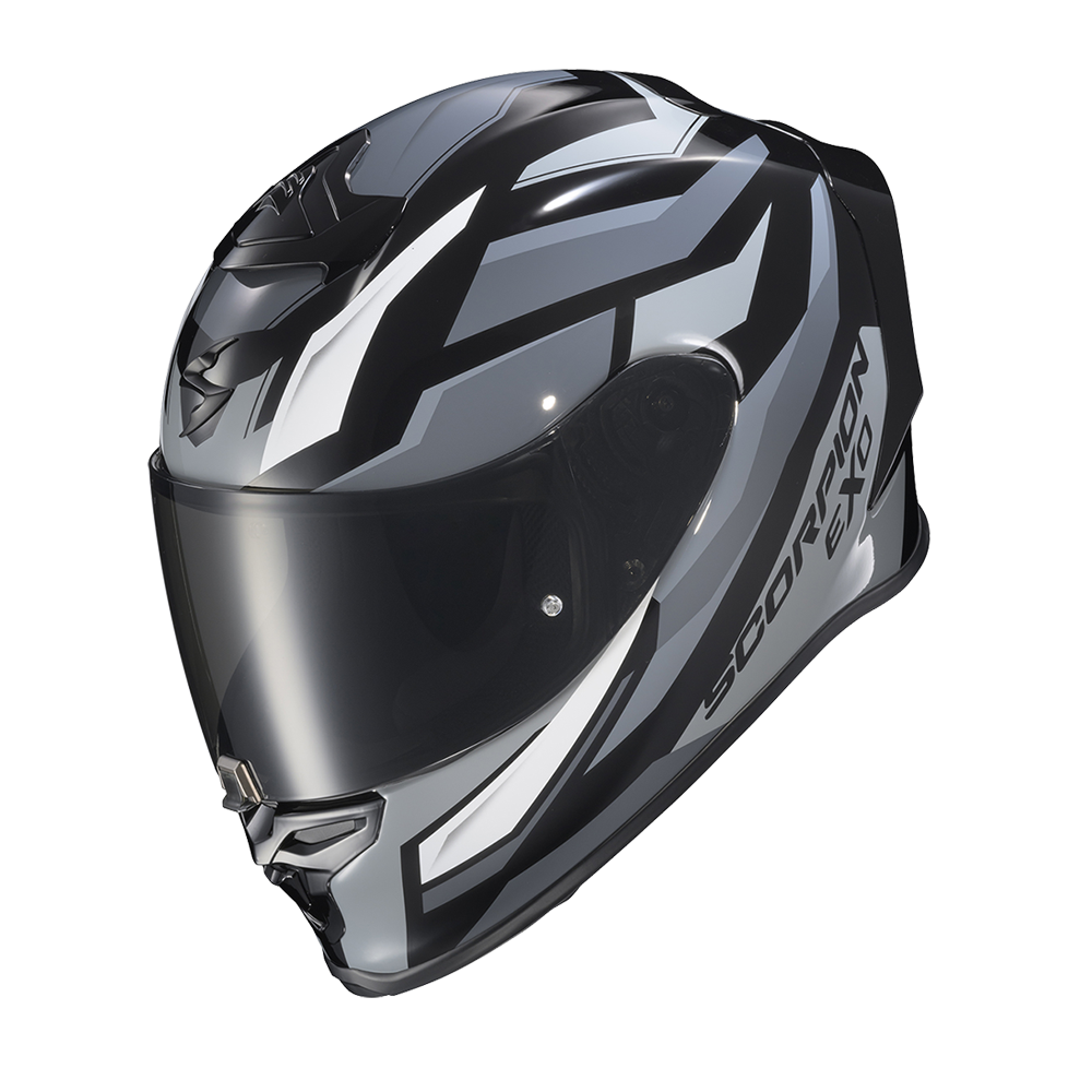 A full-face motorcycle helmet in a glossy black, gray, and white graphic design, featuring a dark visor and 'SCORPION XS' branding on the side, set against a plain white background.