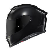 A glossy black full-face motorcycle helmet with a dark visor, shown in a side profile on a plain white background.