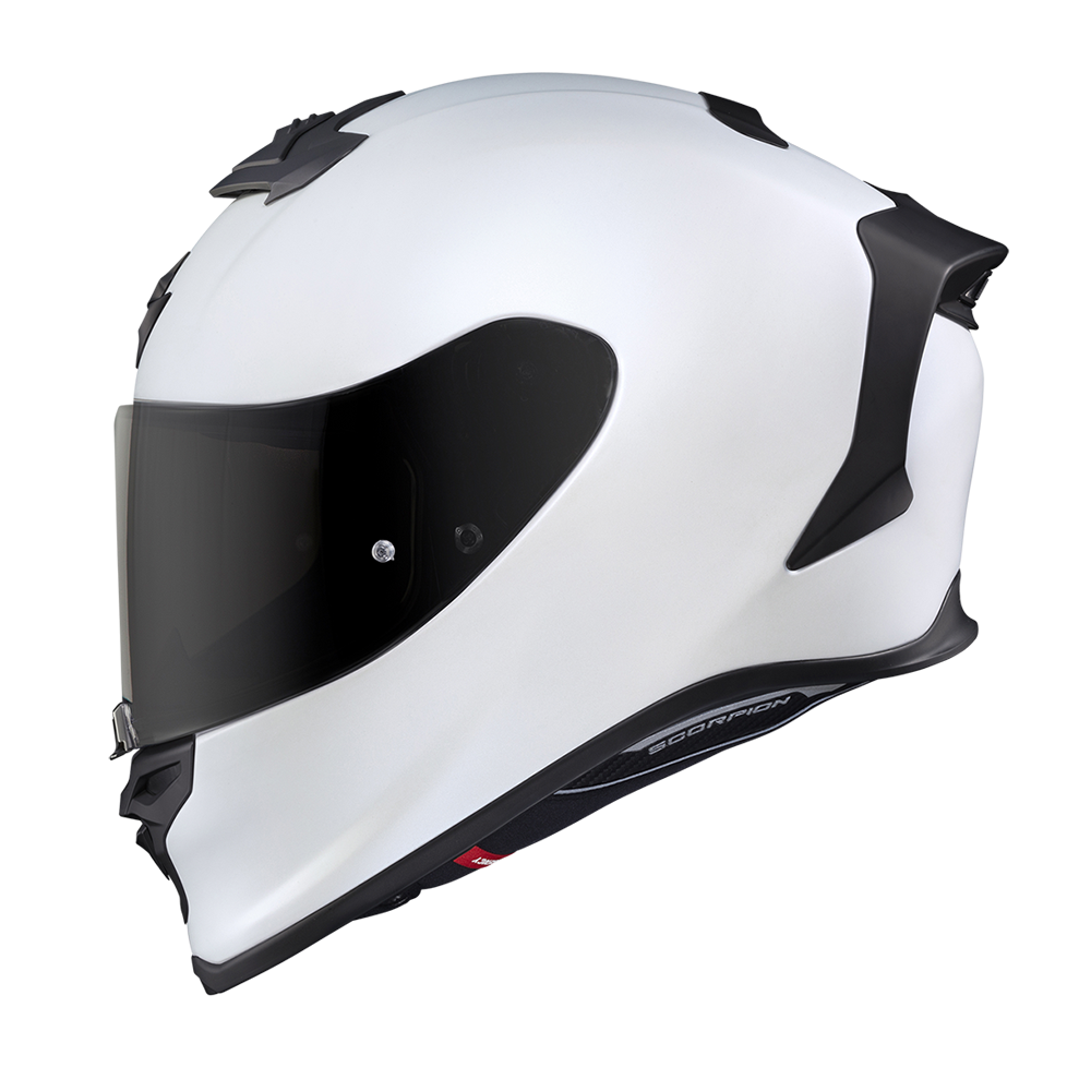 A white full-face motorcycle helmet with a dark tinted visor and black trim details, shown from a side profile on a white background.