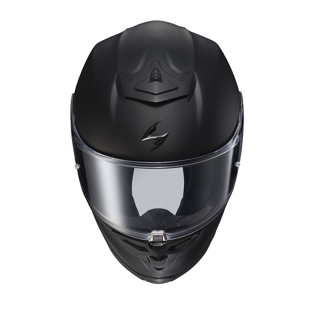 A matte black full-face motorcycle helmet with a clear visor, shown from a top-down angle on a white background.