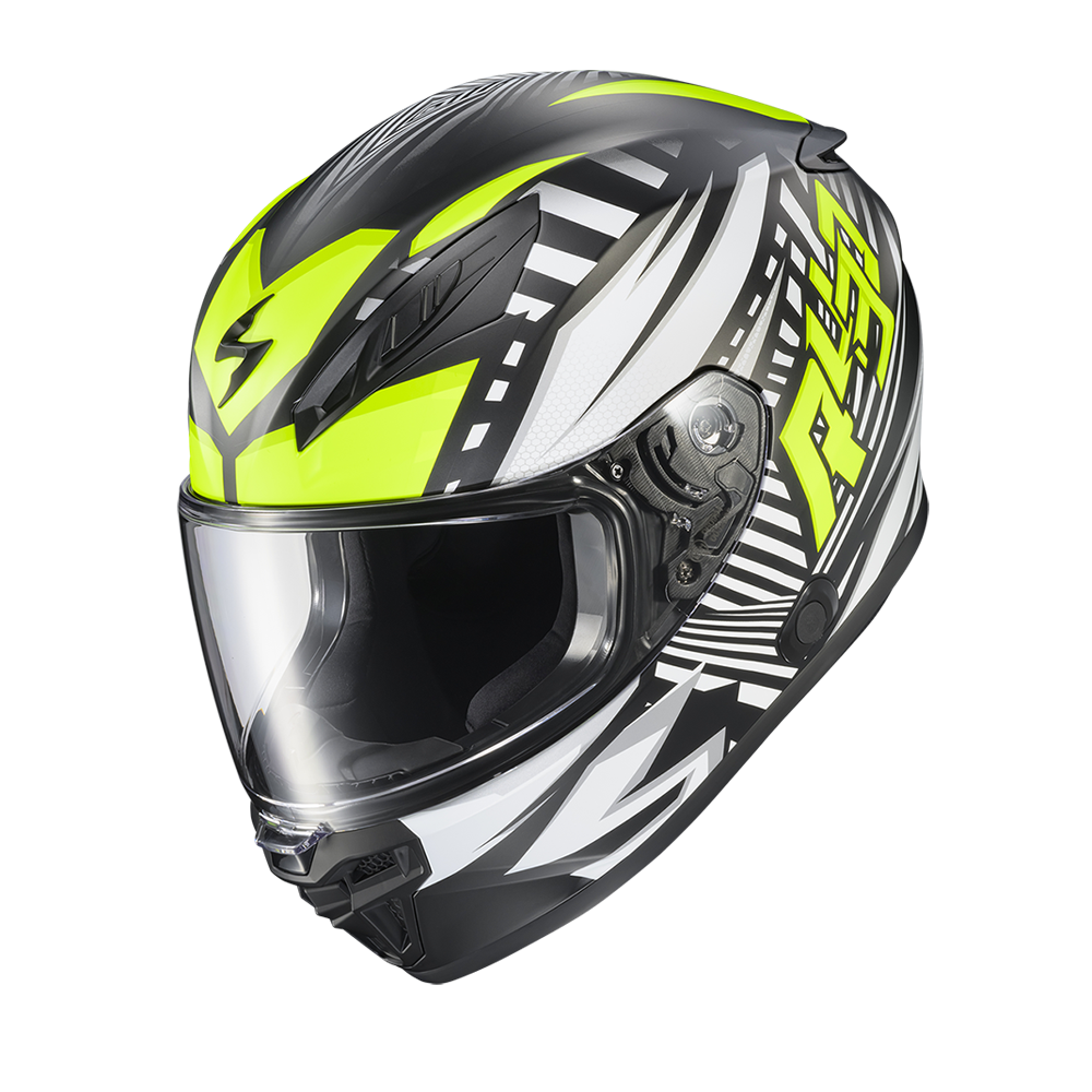 A full-face motorcycle helmet in black, white, and neon yellow, featuring a clear visor and graphic patterns, shown against a plain white background.