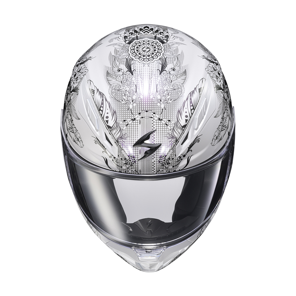 A clear full-face motorcycle helmet with intricate black and gray mandala-style patterns on the shell and a dark reflective visor, shown against a plain white background.