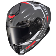 A full-face motorcycle helmet in dark gray with white graphic stripes and red accents, featuring a clear visor and the brand name 'SCORPION PRO' printed on the side.