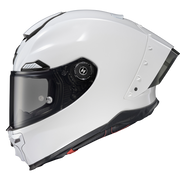 A white full-face motorcycle helmet with a dark visor and black trim details, shown from a side profile on a white background.