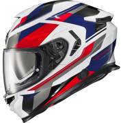 A full-face motorcycle helmet with a white base and bold red, blue, and black graphic stripes, featuring a clear visor and visible 'scramler' branding.