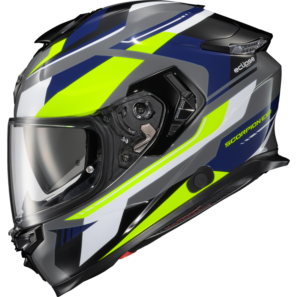A full-face motorcycle helmet with a dark gray, navy blue, white, and neon yellow-green graphic design. The helmet features a clear visor, a black chin bar, and visible branding for 'Scorpion' and 'eclipse'.