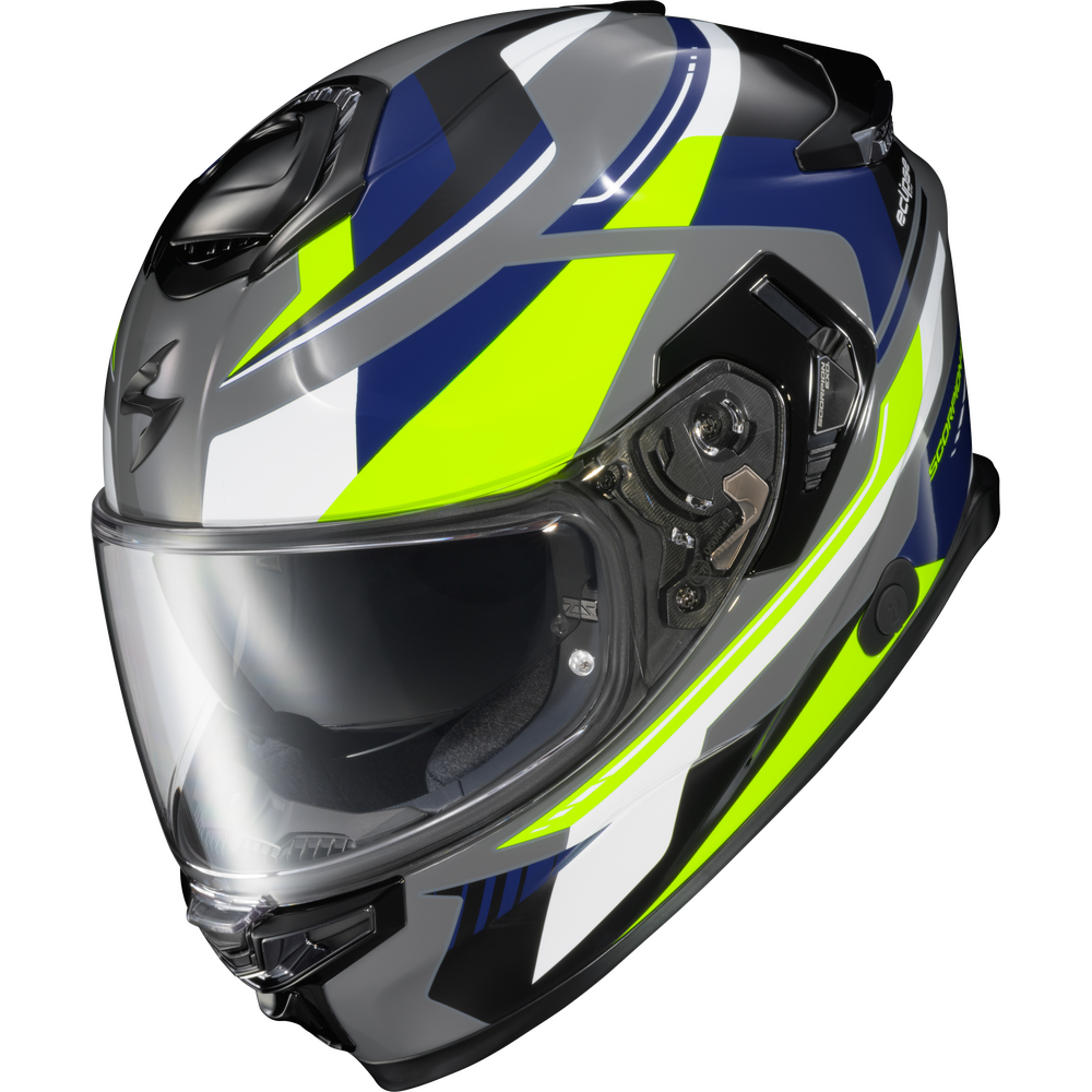 A full-face motorcycle helmet with a dark gray base color and bold graphic patterns in neon yellow, blue, white, and black. The helmet features a clear visor and is photographed on a solid white background.