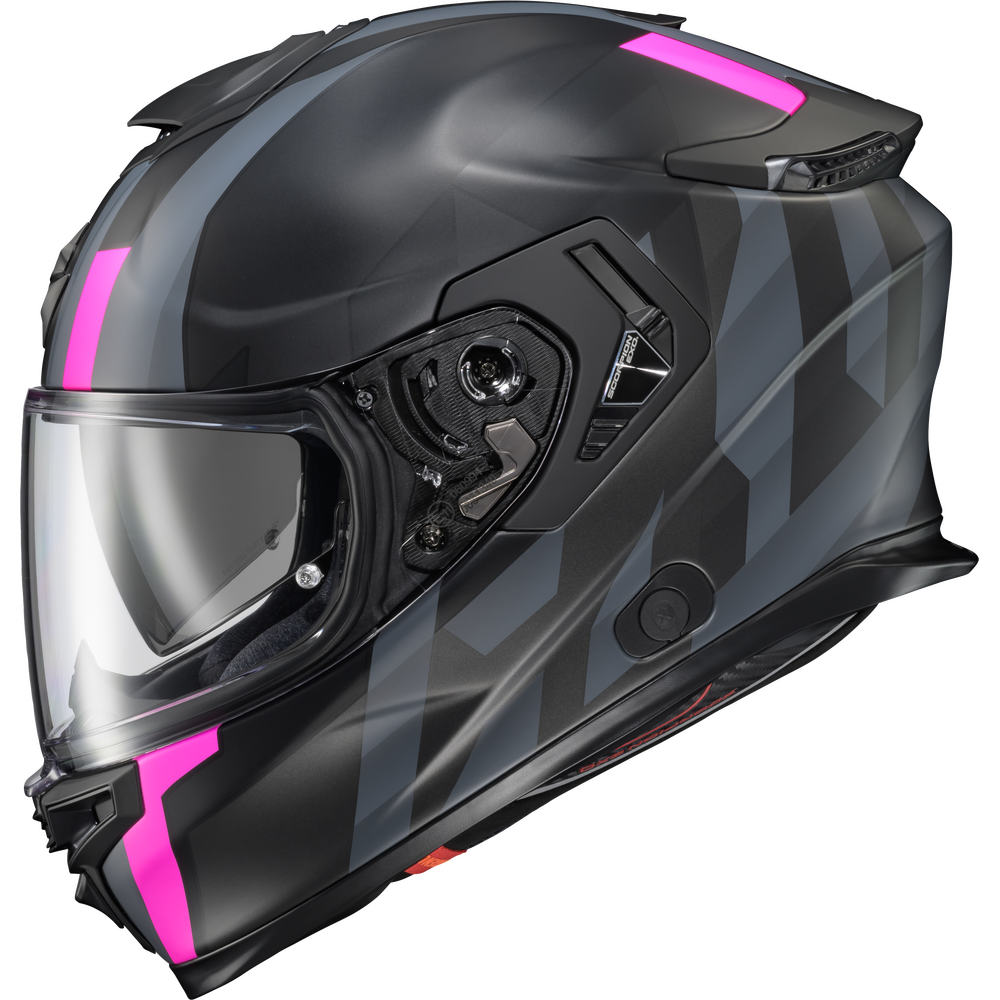 A full-face motorcycle helmet in matte black with a dark gray geometric pattern and vibrant hot pink accents on the visor edge, top, and chin area, shown against a plain white background.