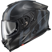 A full-face motorcycle helmet in a matte black finish with a subtle gray geometric pattern on the side, featuring a clear visor.