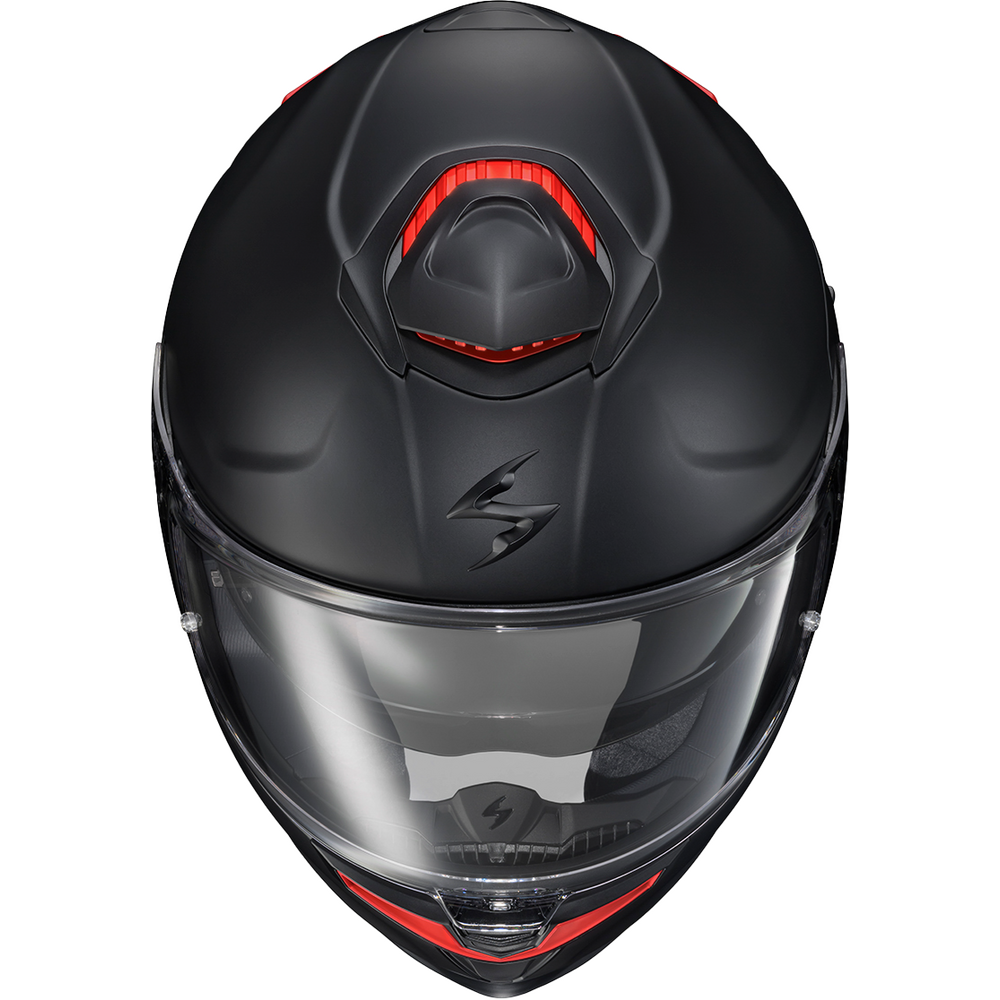 A matte black full-face motorcycle helmet with a clear visor and red accent details, shown from a front-facing perspective on a white background.