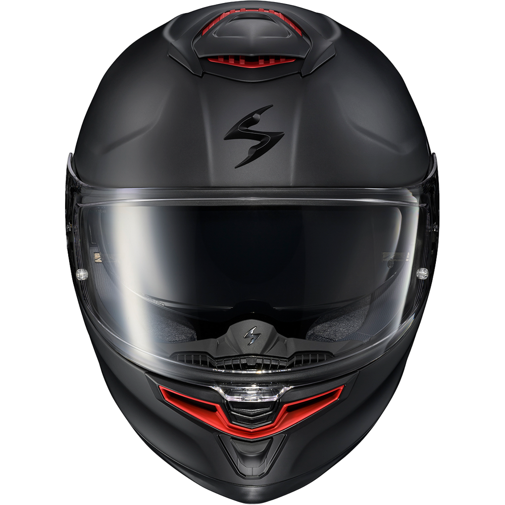 A matte black full-face motorcycle helmet with a clear visor and red accents on the top and lower chin area, shown against a plain white background.