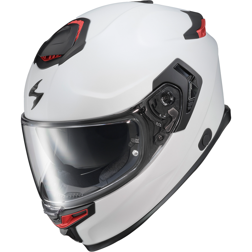 A white full-face motorcycle helmet with black and red accents, a clear visor, and a black side-mounted communication/control unit, shown on a plain white background.