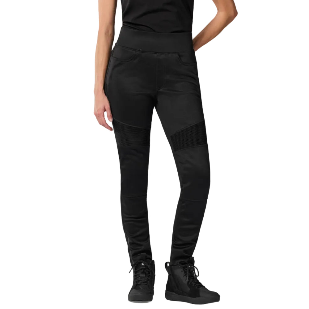 Person wearing black pants and black shoes on a white background