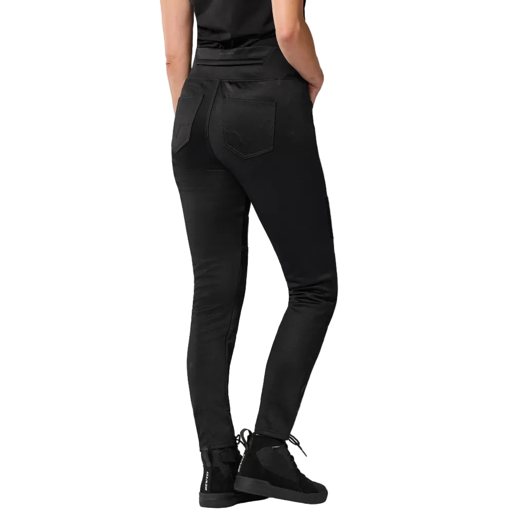 Person wearing black pants with a white background