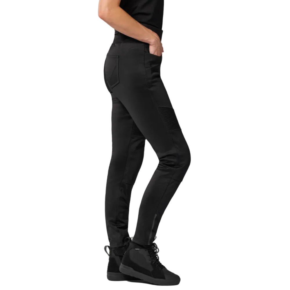 Person wearing black pants and black shoes on a white background