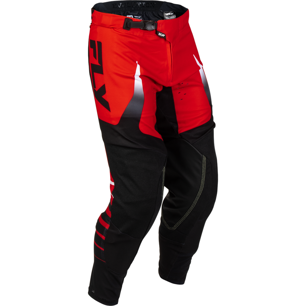 Red and black motocross pants with a large black FXR logo on the left thigh and white graphic accents, shown on a plain white background.