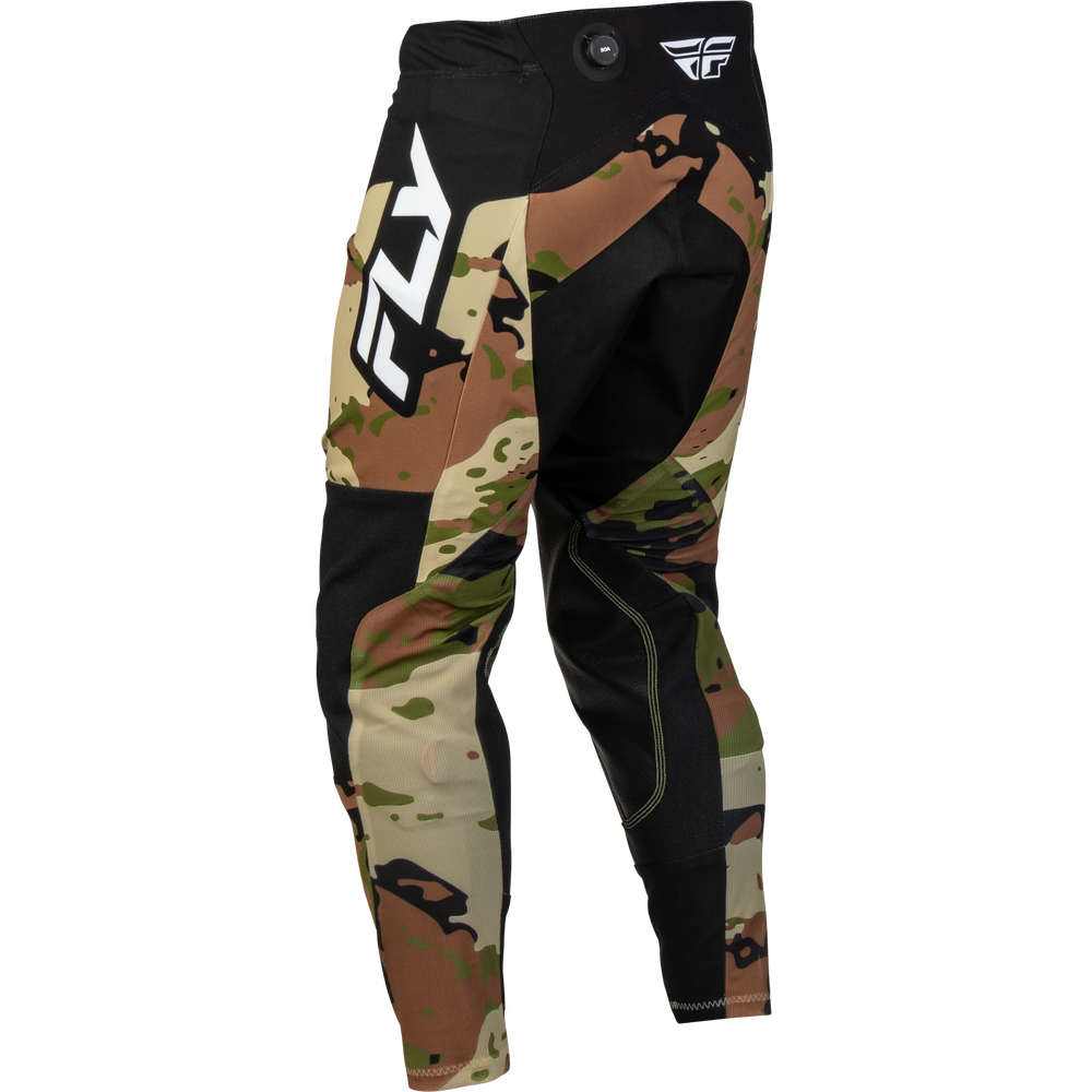 A pair of Fly Racing motocross pants featuring a black base with a brown, green, and beige camouflage pattern on the lower legs and a large white 'FLY' logo on the side.